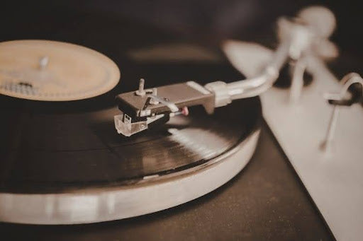 Close-up of turntable needle on vinyl record.
