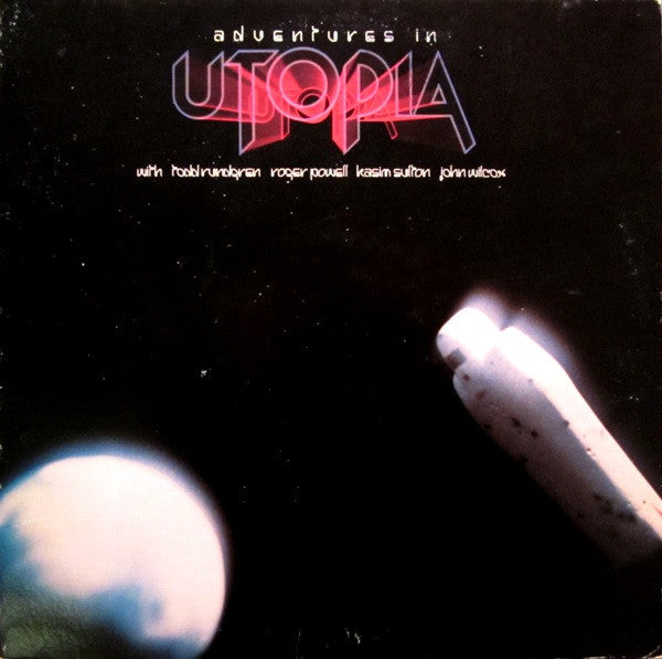 Utopia (5) – Adventures In Utopia – Release:b2dd1826-e592-4ece-838f-016e95170f8a (cover)